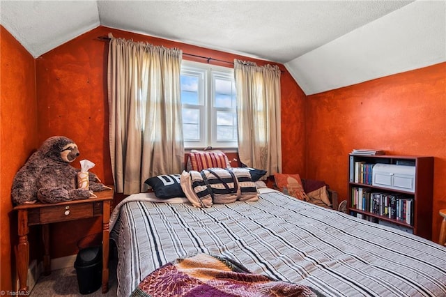 bedroom featuring lofted ceiling