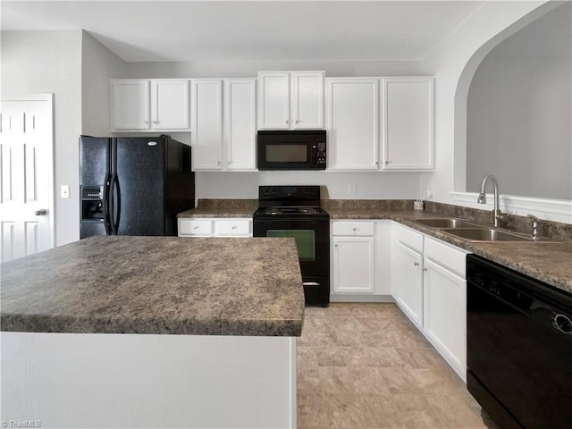 kitchen featuring white cabinetry, sink, and black appliances