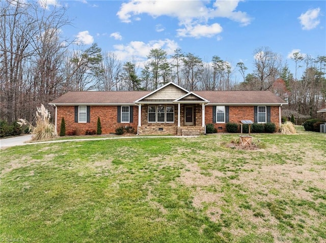 ranch-style home with crawl space, brick siding, and a front lawn