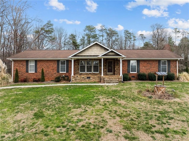 ranch-style house with crawl space, brick siding, and a front lawn