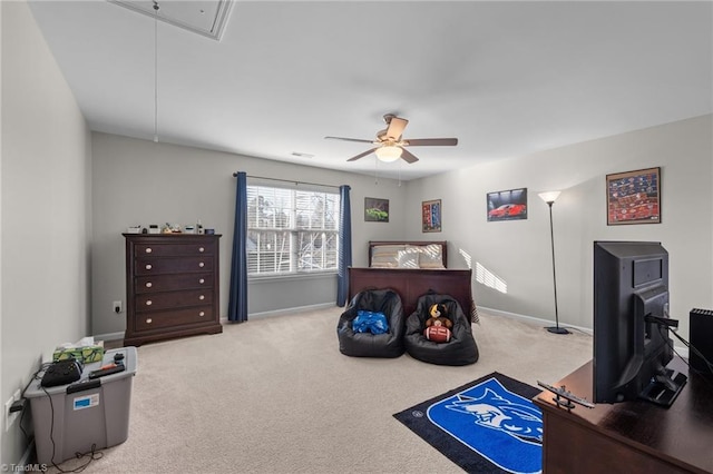 bedroom with carpet, attic access, baseboards, and ceiling fan