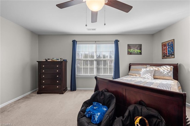 carpeted bedroom with ceiling fan, visible vents, and baseboards