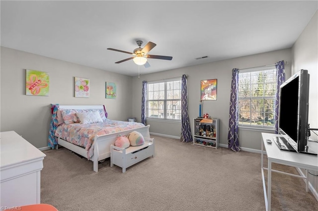 bedroom with baseboards, visible vents, carpet flooring, and multiple windows