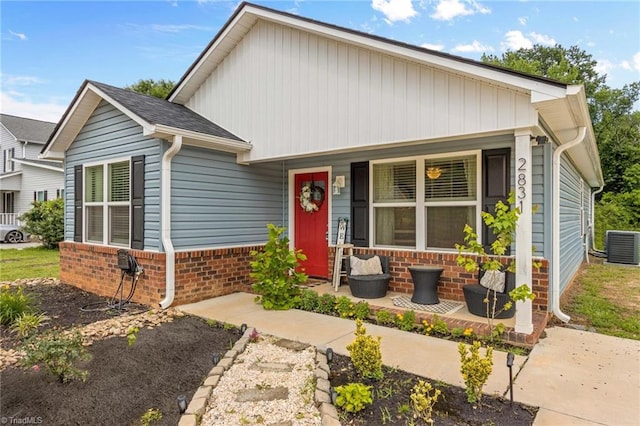 view of front of property featuring covered porch and central air condition unit