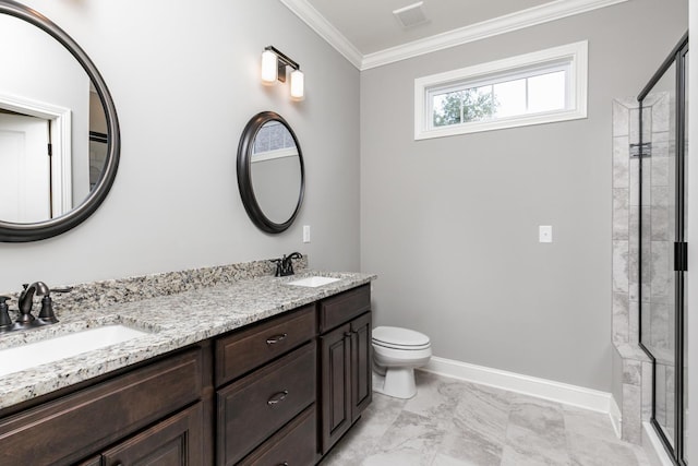 bathroom featuring an enclosed shower, crown molding, toilet, and dual bowl vanity