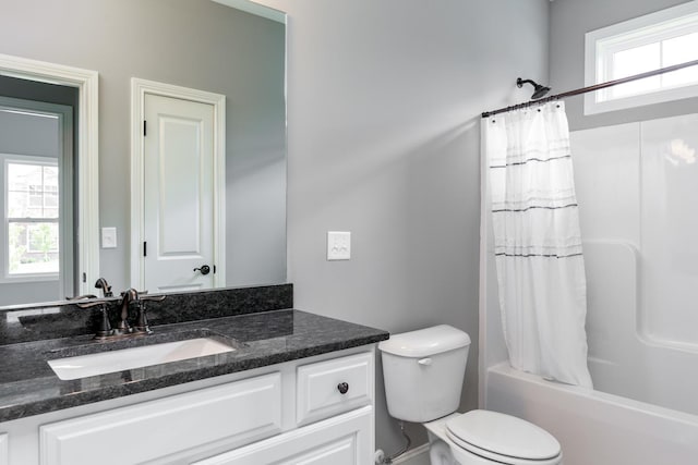 full bathroom with shower / bath combination with curtain, toilet, and vanity with extensive cabinet space