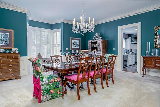 dining space featuring a chandelier, light colored carpet, and ornamental molding