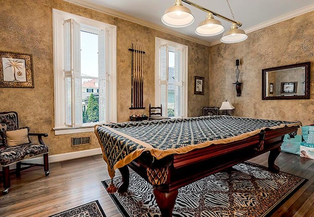 recreation room with ornamental molding, hardwood / wood-style floors, and pool table