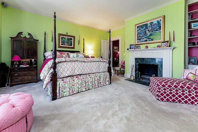 bedroom with crown molding, carpet flooring, and a premium fireplace