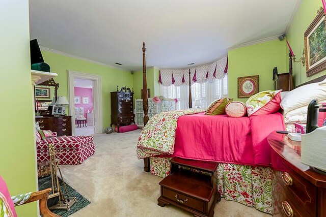 carpeted bedroom with crown molding