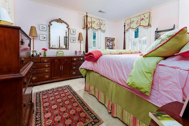 carpeted bedroom featuring ornamental molding