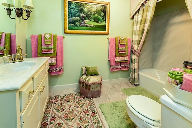 full bathroom with shower / bath combination with curtain, large vanity, tile floors, and toilet