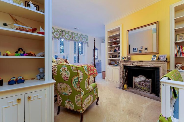 living area with crown molding, light colored carpet, and built in shelves