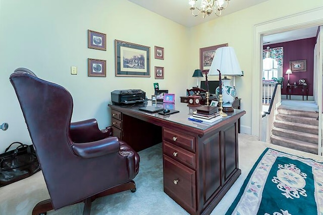 carpeted home office featuring a notable chandelier