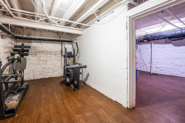 workout area with dark hardwood / wood-style floors