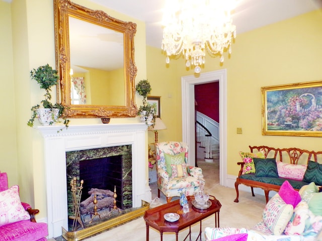 carpeted living room featuring a notable chandelier and a premium fireplace