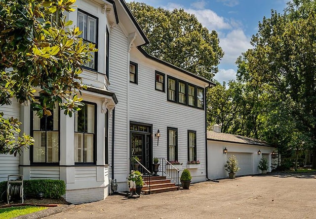 view of front of home with a garage