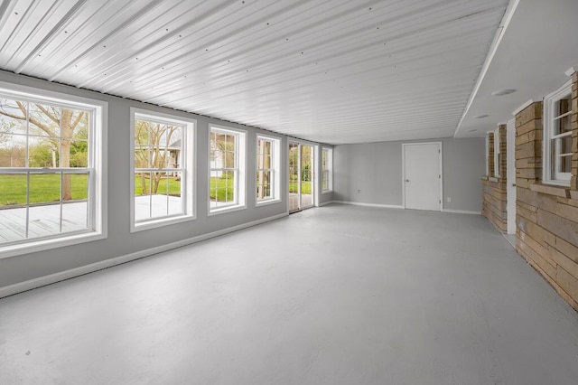 unfurnished sunroom featuring a healthy amount of sunlight