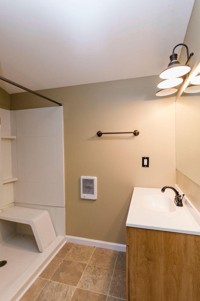 bathroom featuring tile floors and vanity