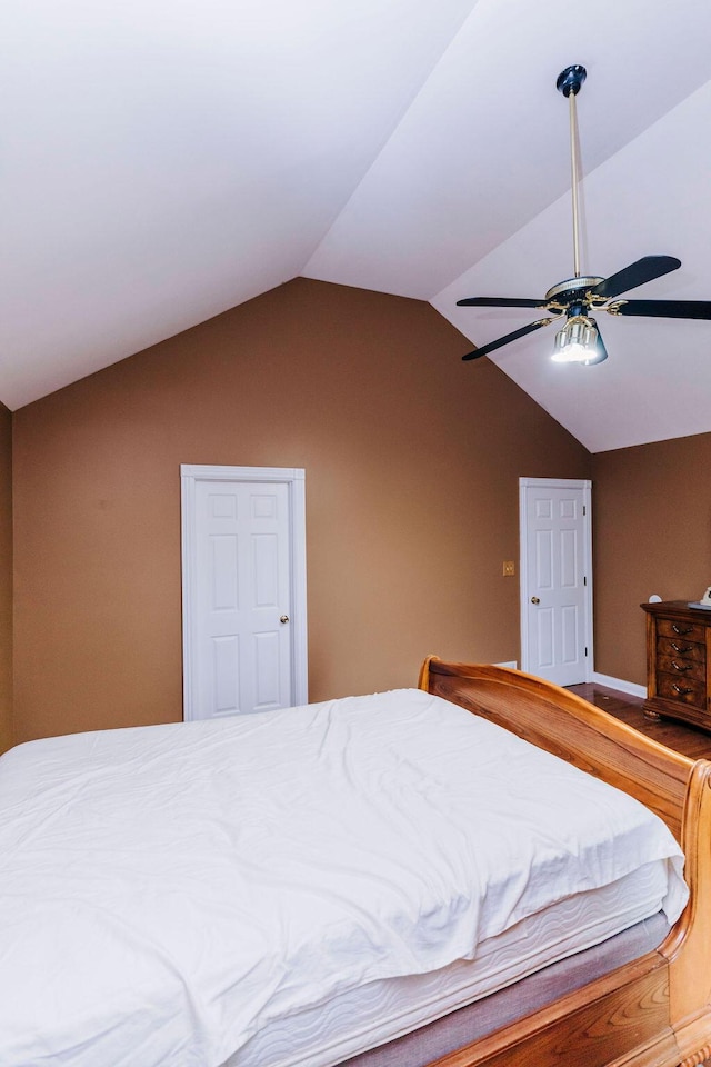 bedroom with lofted ceiling and ceiling fan