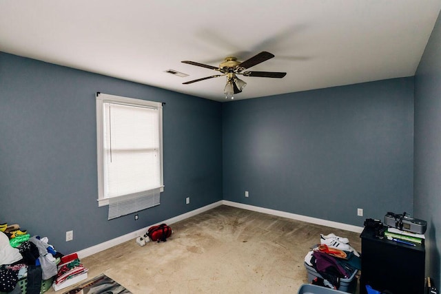 interior space featuring ceiling fan and carpet flooring