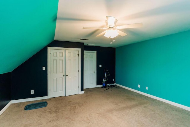 bonus room featuring carpet floors, vaulted ceiling, and ceiling fan