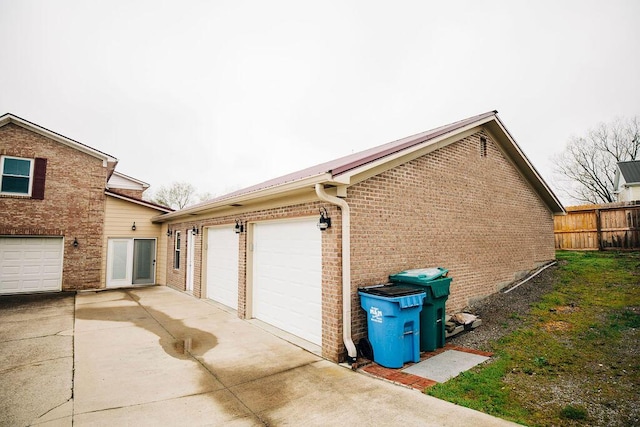 view of side of property with a garage