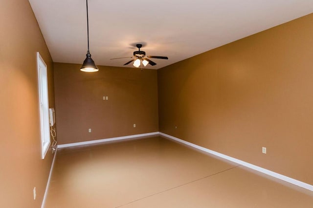 unfurnished room with ceiling fan