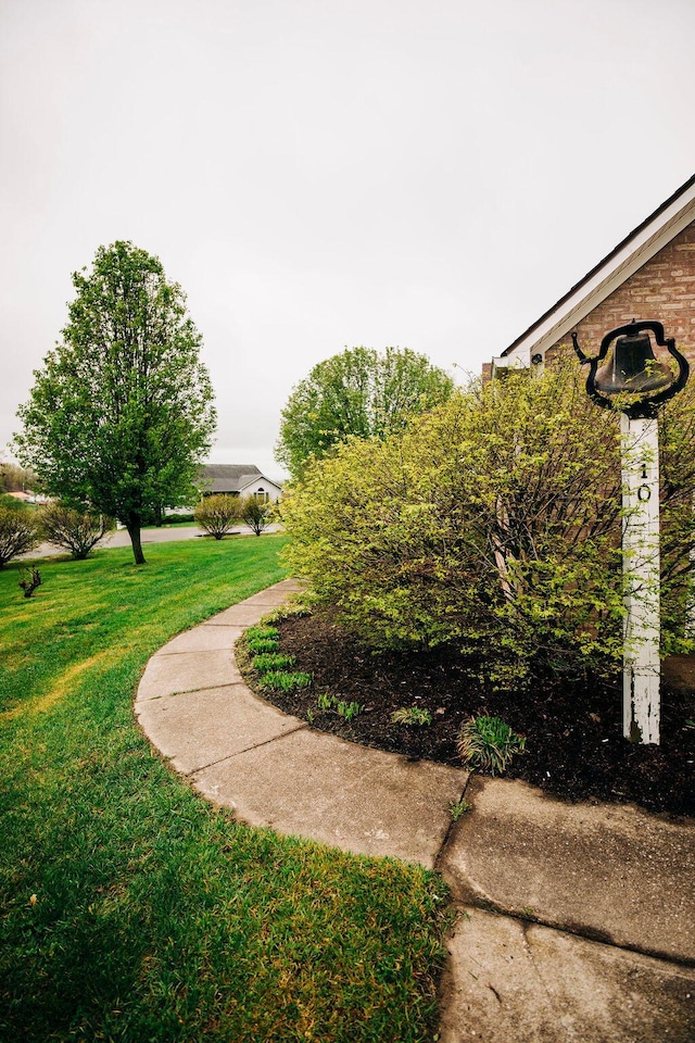 surrounding community featuring a lawn