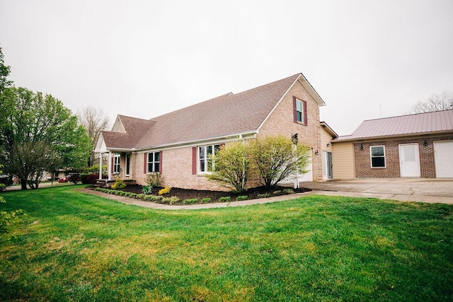 view of front of home with a front lawn and a garage