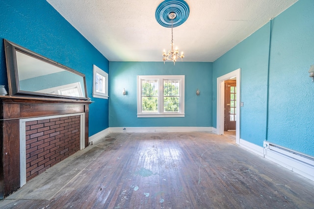 interior space featuring a notable chandelier, dark hardwood / wood-style floors, and a textured ceiling