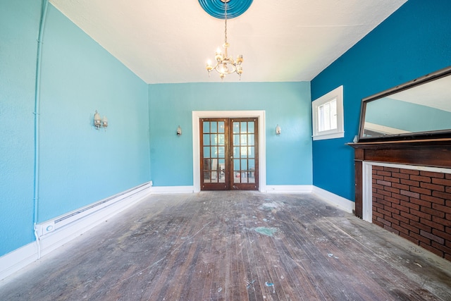 unfurnished living room featuring french doors, an inviting chandelier, and dark hardwood / wood-style floors