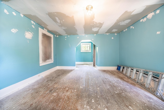 spare room with wood-type flooring