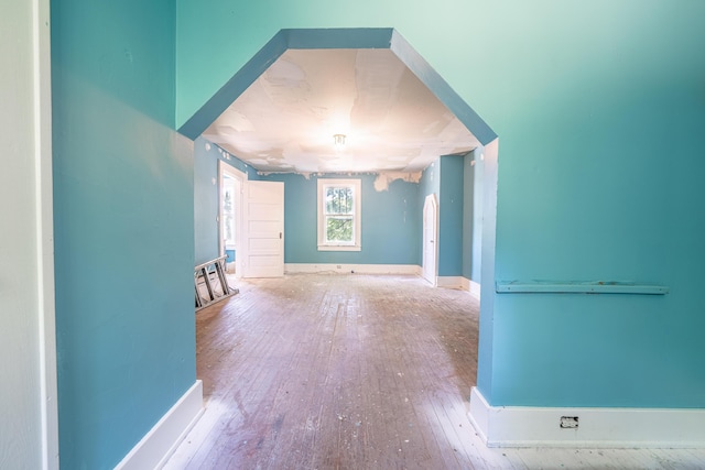 additional living space featuring light hardwood / wood-style flooring