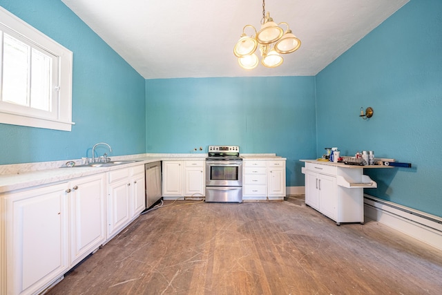 kitchen with white cabinetry, stainless steel appliances, a notable chandelier, pendant lighting, and sink