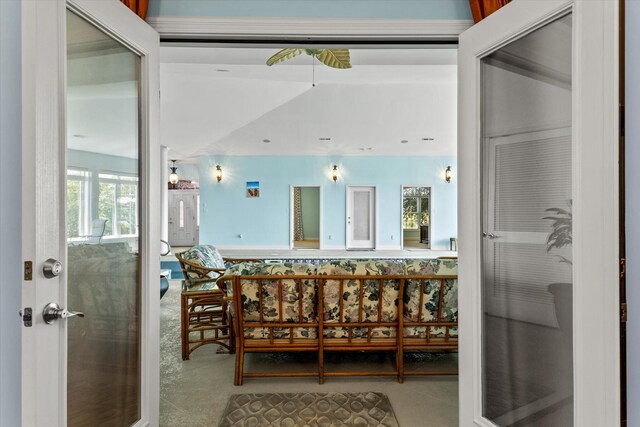 bedroom with light colored carpet and a notable chandelier