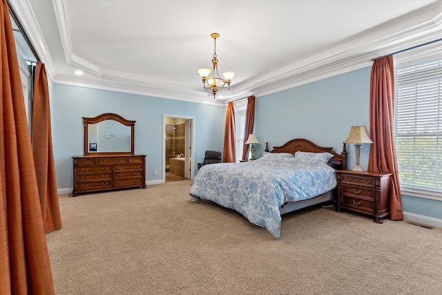 carpeted bedroom with a raised ceiling, a chandelier, ornamental molding, and ensuite bath