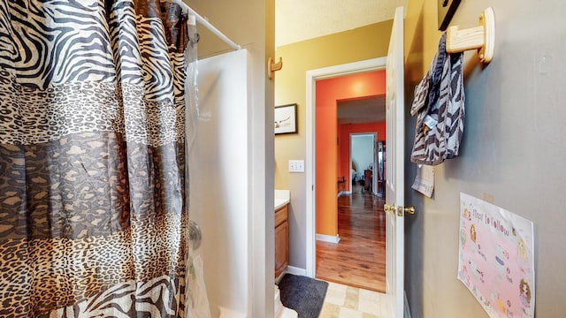 bathroom featuring vanity and tile flooring