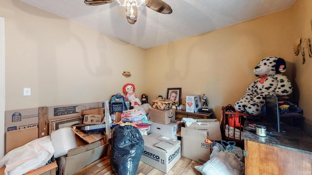 miscellaneous room featuring ceiling fan and light wood-type flooring