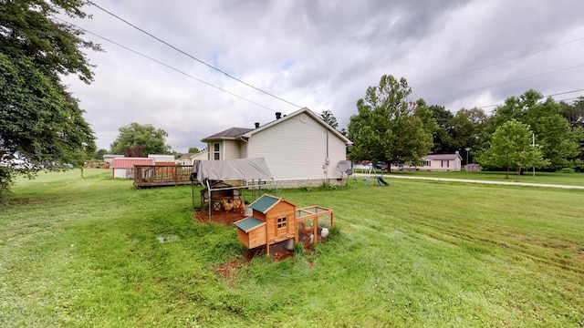 view of yard featuring a wooden deck