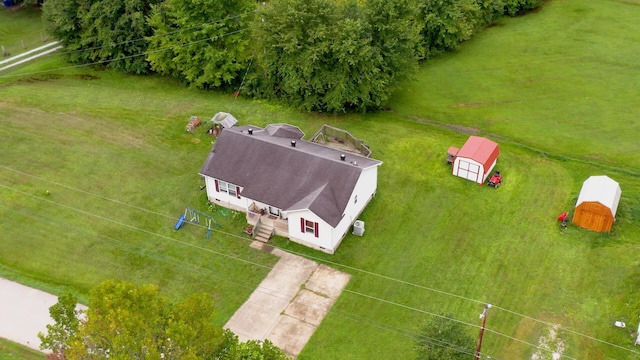 birds eye view of property with a rural view