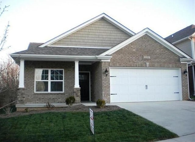 craftsman-style home with a front lawn and a garage