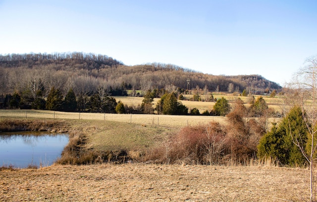 mountain view featuring a rural view