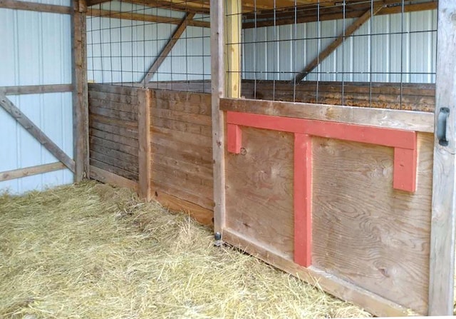 view of horse barn with an outdoor structure