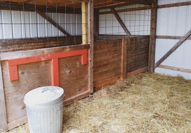 view of horse barn with an outdoor structure