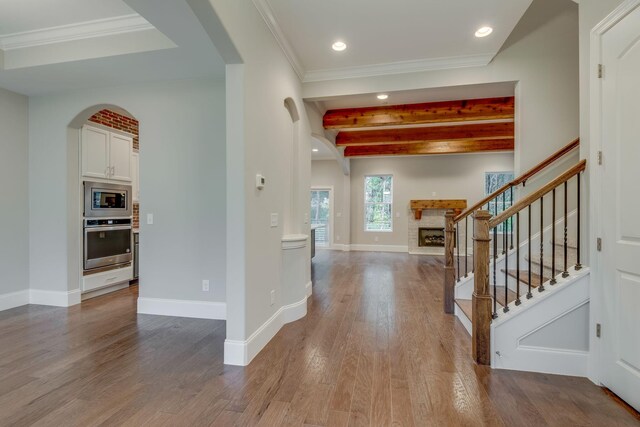 foyer featuring beam ceiling and hardwood / wood-style flooring