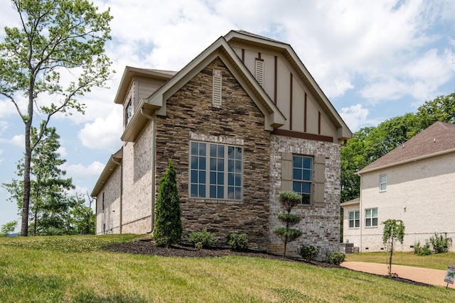 view of property exterior with a yard