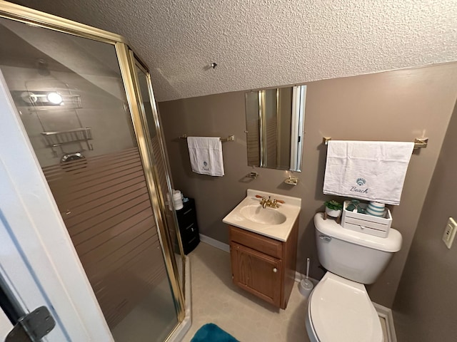 bathroom featuring a shower with shower door, toilet, vanity, and a textured ceiling