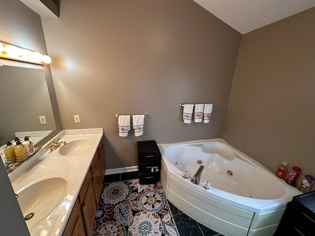 bathroom featuring dual vanity, tile patterned flooring, and a textured ceiling