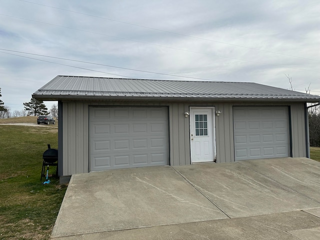 garage with a lawn